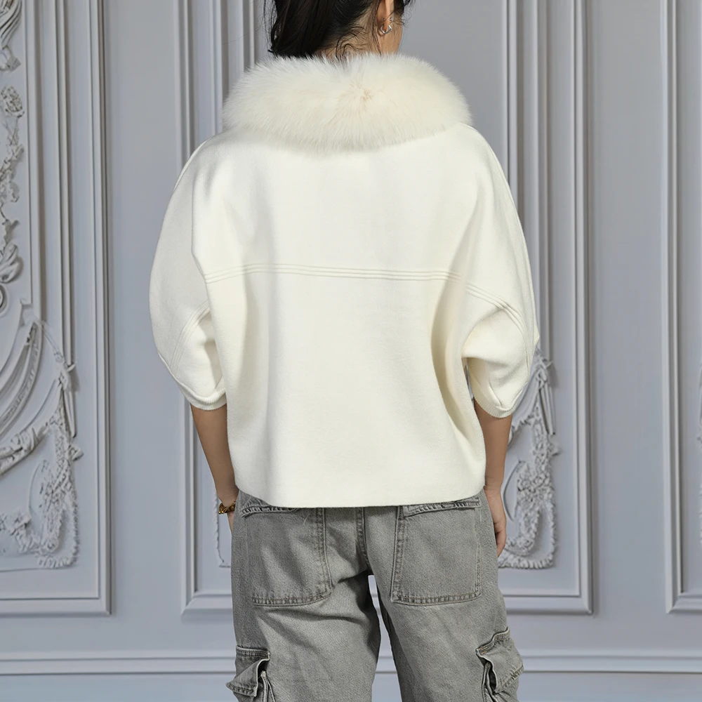 Covered button closure on wool blend sweater