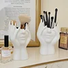 Nordic Abstract Face Makeup Brush Holder Organizer Plastic Cosmetic Brush Cup Pen Holder Flower Vase for Vanity Desk Home Decor 1