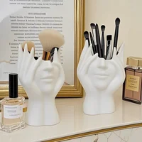 Nordic Abstract Face Makeup Brush Holder Organizer Plastic Cosmetic Brush Cup Pen Holder Flower Vase for Vanity Desk Home Decor 1