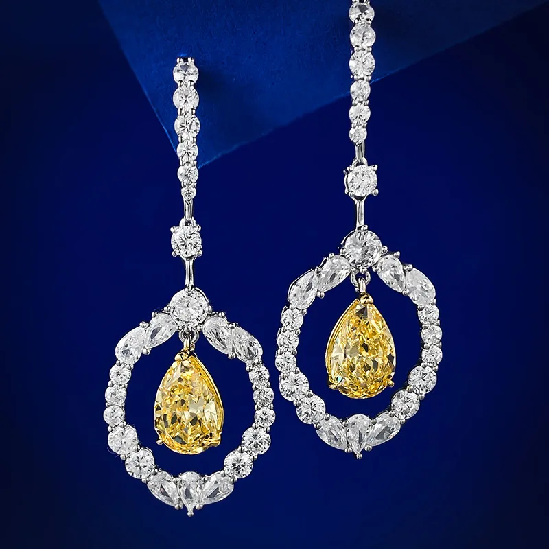 

Серьги из серебра 925 пробы в форме груши 8*12 мм с желтыми бриллиантами