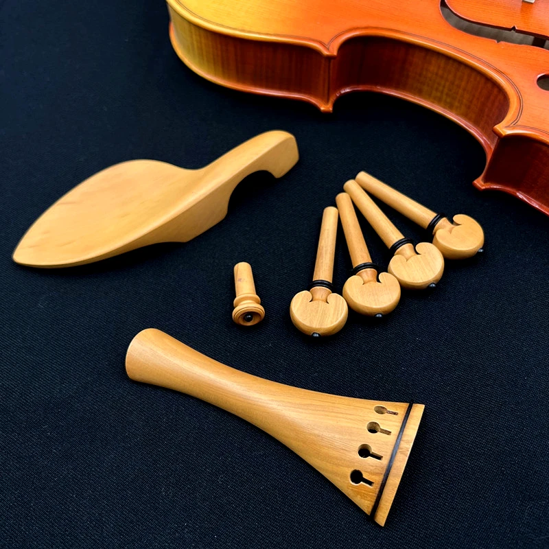 Description Picture 4 of item1 set High quality 4/4 violin viola Boxwood accessories parts fittings,Tailpiece+Tuning pegs+Endpins+Chin rest/Chin Holder