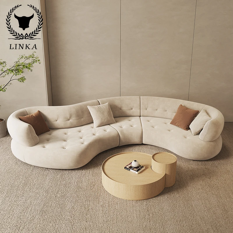 

New advanced Italian curved sofa with special-shaped corner, simple modern cream fabric in living room.