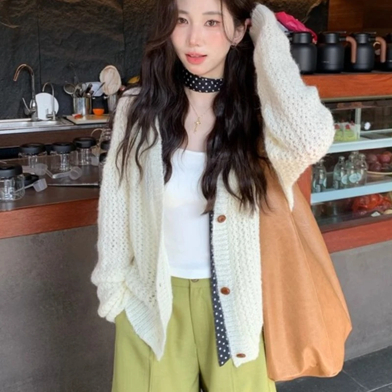 Autumn New Women's Loose Long-sleeved Cardigan Sweater Fashionable Women's Elegant Casual Knitted Hollow Versatile Top