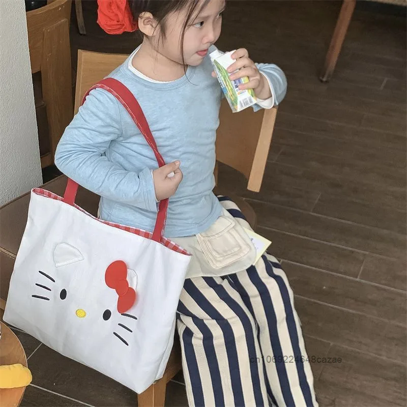 Sanrio 헬로 키티 패션 토트 백 여성의 새로운 트렌드 대용량 핸드백 하라주쿠 단순 캐주얼 통근 캔버스 숄더 백