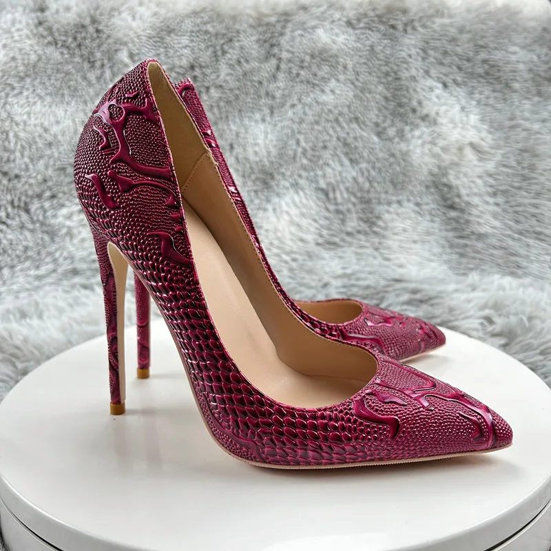 Burgundy lacy underwear and sexy high heel shoes on shiny white
