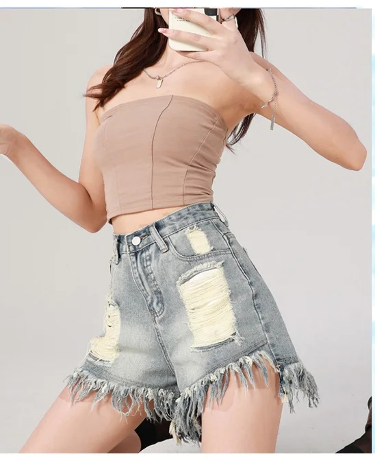 Hot selling vintage distressed rough edge denim shorts for 2023 women's summer loose fitting slim high waisted A-line hot pants