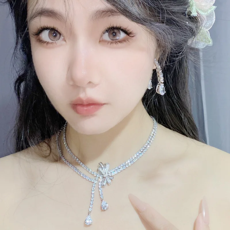 2023 Women Brilliant Bow Tie Earrings Plated 18K Gold Exquisite Water Drops Exaggerate Necklace Ring 4