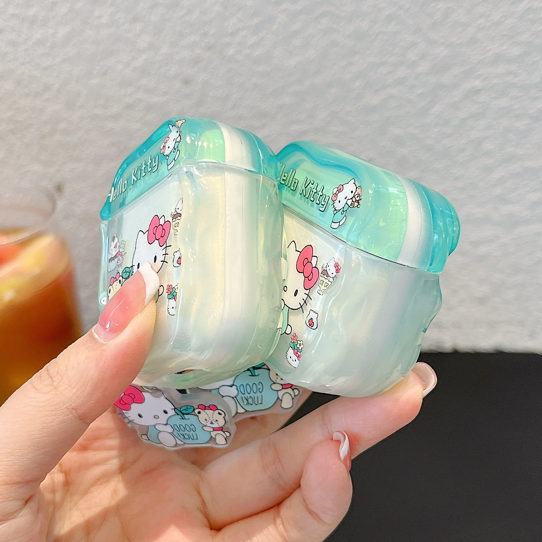 Charming Glossy TPU Earphone Case with Pendant - HelloKitty, MySweetPiano & Gudetama Design