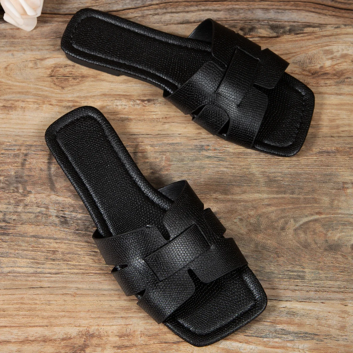 Black leather women's slippers with exposed heels, flat sandals - Main Image