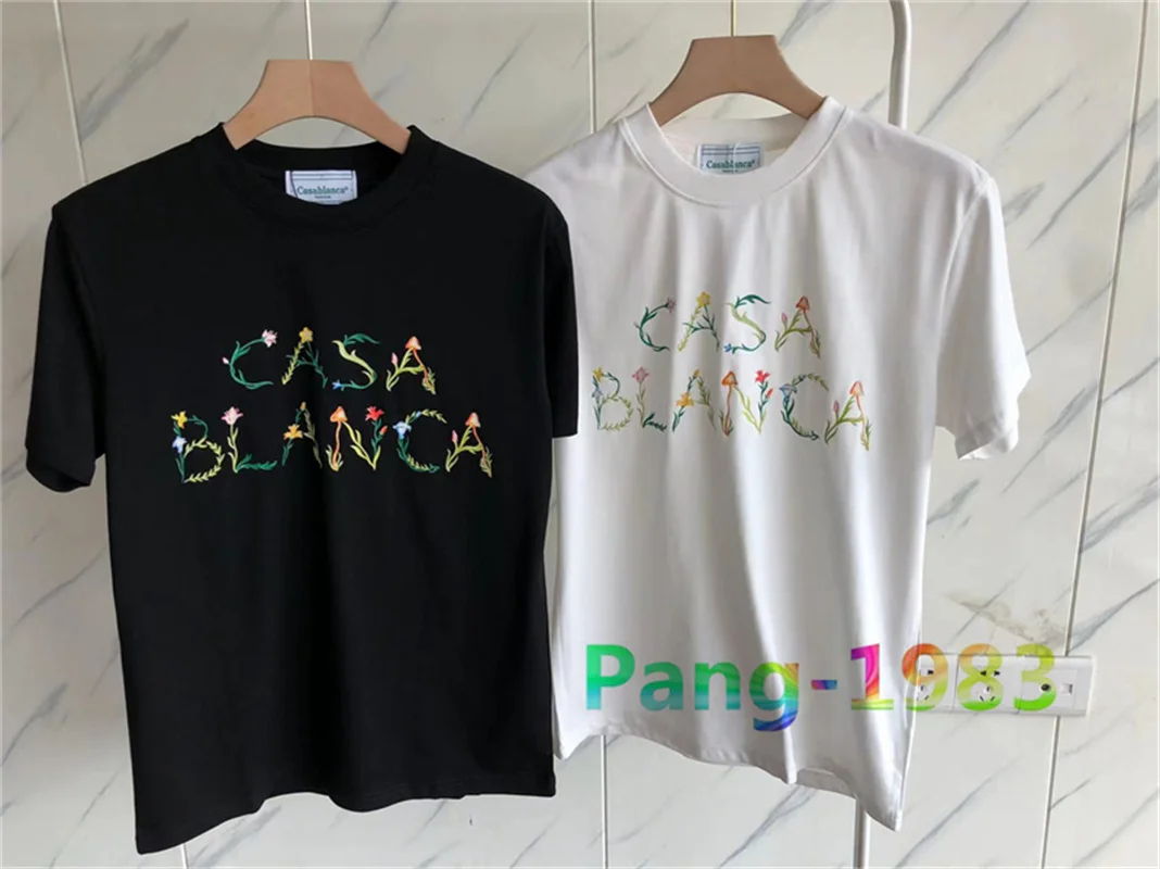 

Футболка из мягкой ткани с цветочным логотипом и буквенным принтом для мужчин и женщин