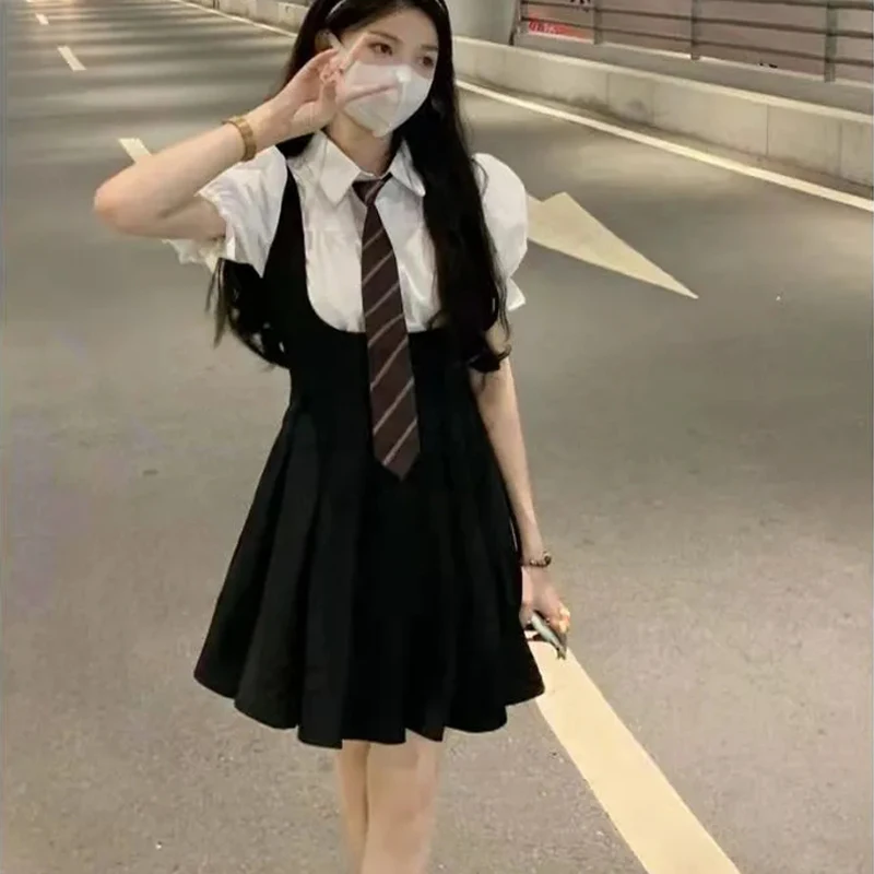 

Summer Korean Version Of The Two-Piece Suit College Style Uniform Bubble Sleeve Shirt Halter Pleated Skirt Small Black Skirt Bac