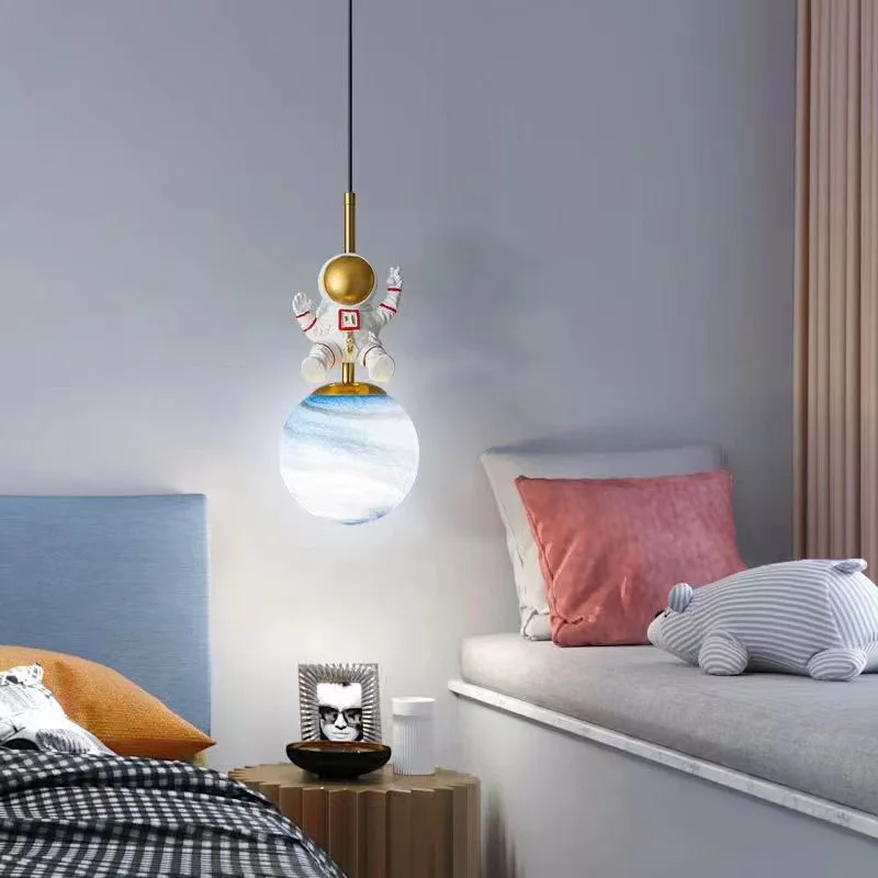 A child's bedroom with a bed and a creatively designed floating Astronaut Pendant Light hanging above it.