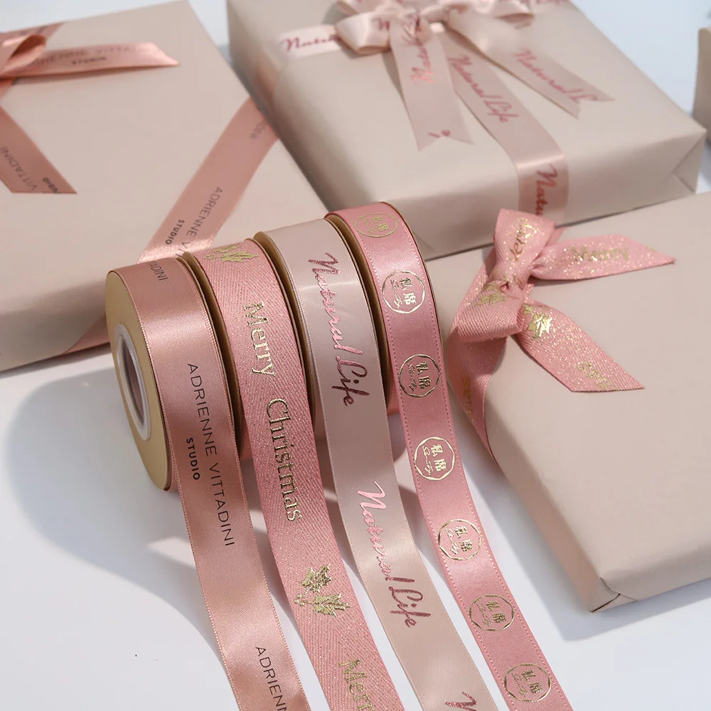 

Customized 3D Logo New Design Christmas Birthday Gold Stamping Ribbon With Logo Decorative Gold Foil Branded Ribbon For Jewelry