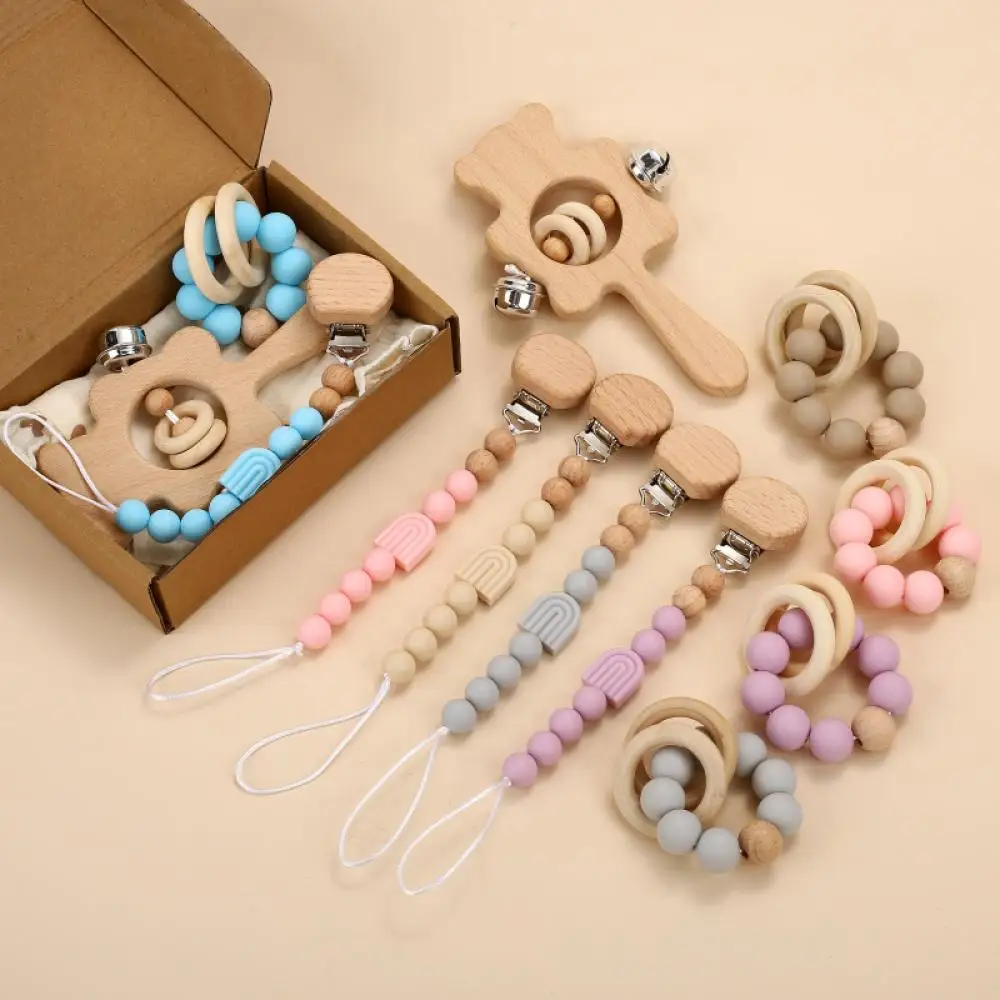 

3Pcs Set Boxed Baby Wooden Handheld Rattle Baby Silicone Pacifier Clip Chain Wood Ring Teether Bead Bracelet Cotton Bib Care Toy