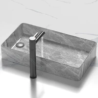 อ่างล้างหน้าเซรามิกดีไซน์หรูทันสมัยสำหรับห้องน้ำ อ่างล้างหน้าแบบวางบนเคาน์เตอร์พร้อมอุปกรณ์ระบายน้ำ 2