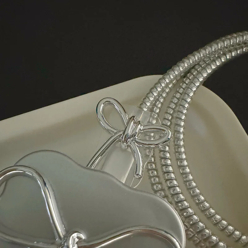 Luxury Electroplating Bowknot Charger Cover with Charge Protection Features