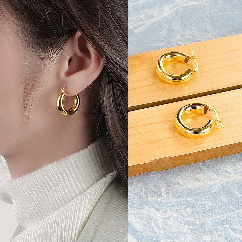 Artistic photo of irregular metal hoops on soft fabric