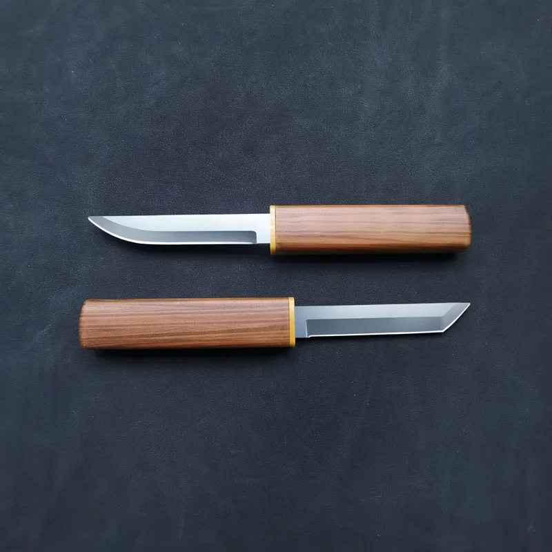 Knife lying on a textured background highlighting blade shape