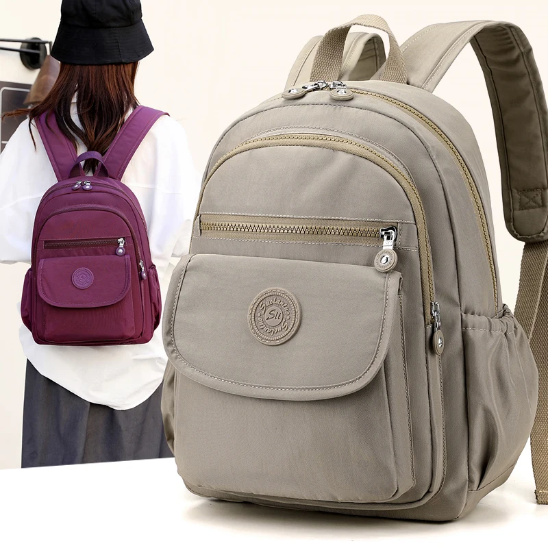 Ladies' lightweight, large capacity stylish black commuter travel backpack with adjustable shoulder straps, school and leisure b