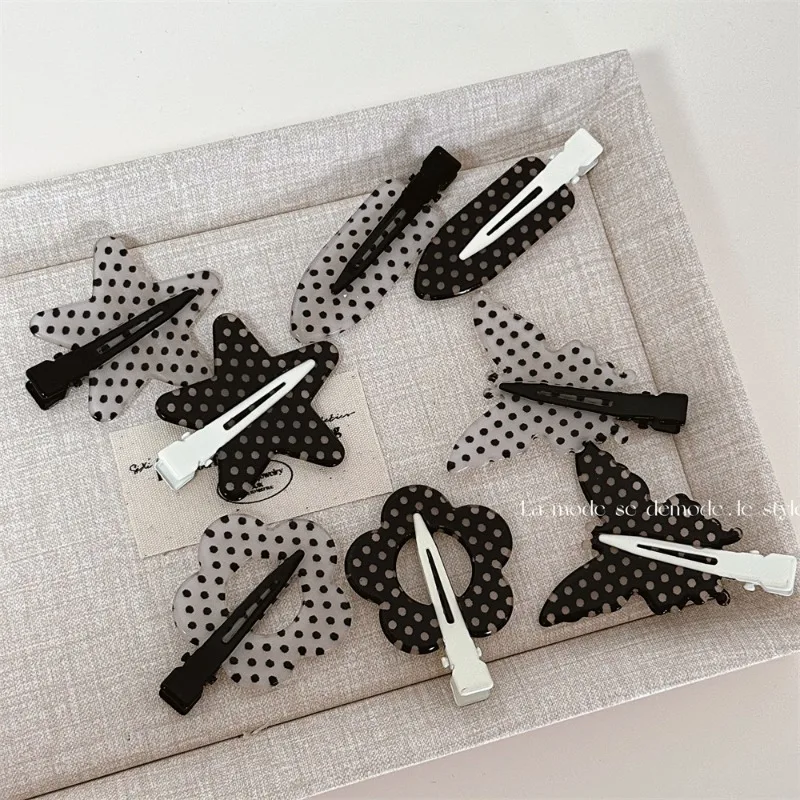 White and black polka dot hair clip