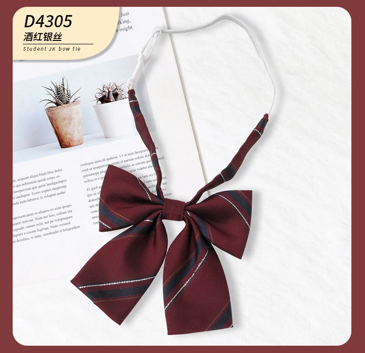 Multiple striped bow ties displayed on white and book background