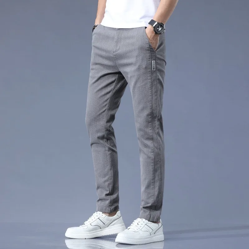 Men's Casual Pants New Spring and Summer Korea Loose Small Feet Pants Stretch Sports Elastic Waist Zipper Button Long Pants