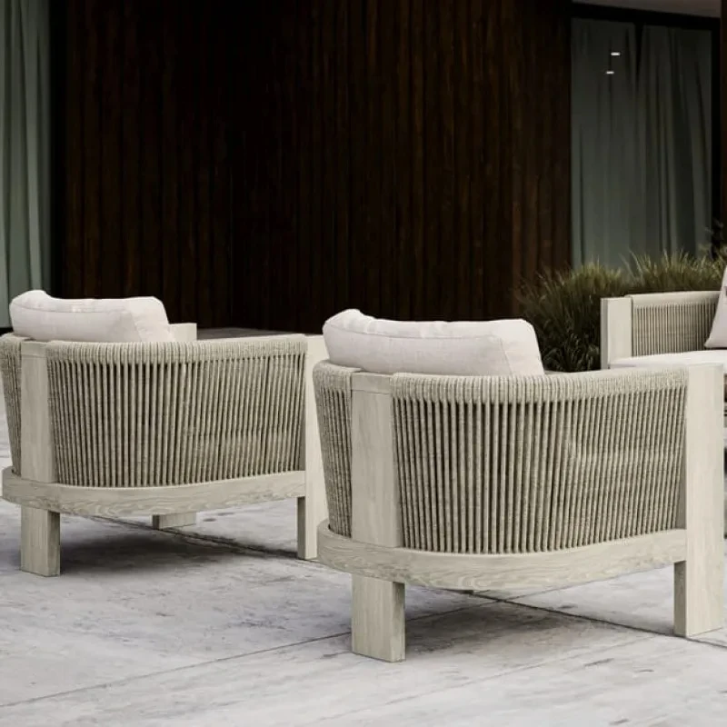 Outdoor garden armchair made of teak wood and woven acrylic, the fabric used for the cushions is waterproof and UV resistant.