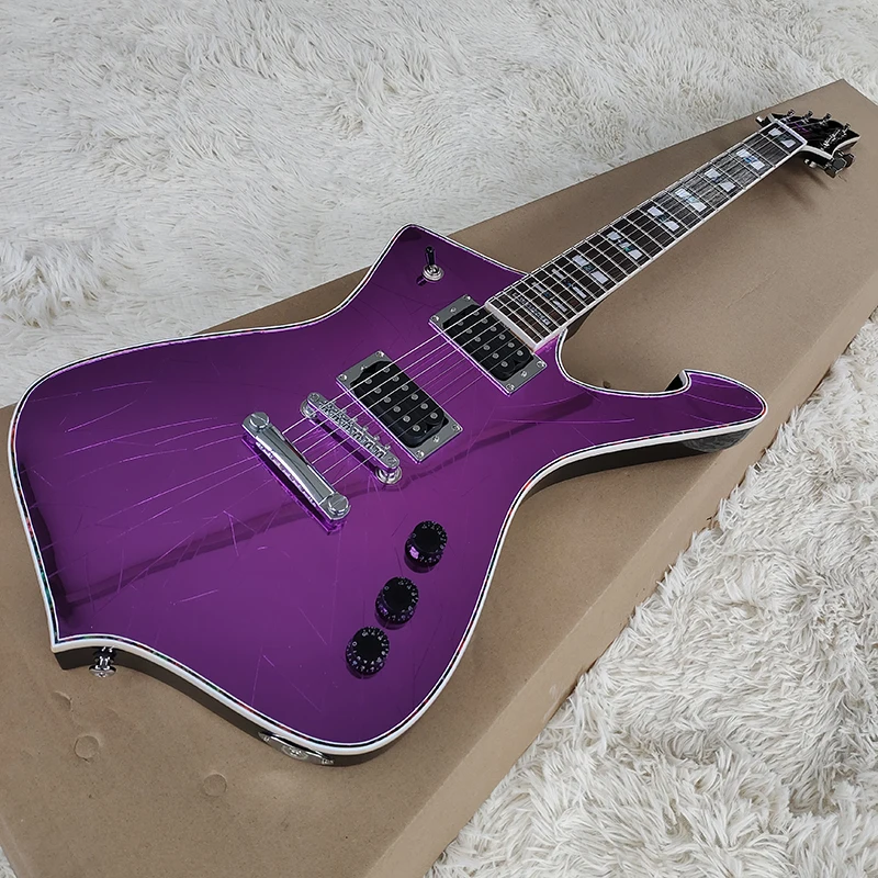 

This is a purple bright surface special-shaped electric guitar. It is made of solid wood and has a beautiful tone.