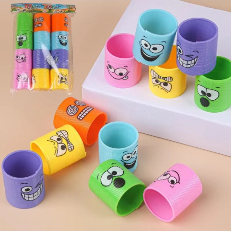thumbnail image 1 of 12 piezas/bolsa 3,2*3,5 cm Mini anillo de círculo de arcoíris de emoji mágico colorido resorte grande juguete de bobina de plástico arcoíris mágico resorte flexible, 1 of 5