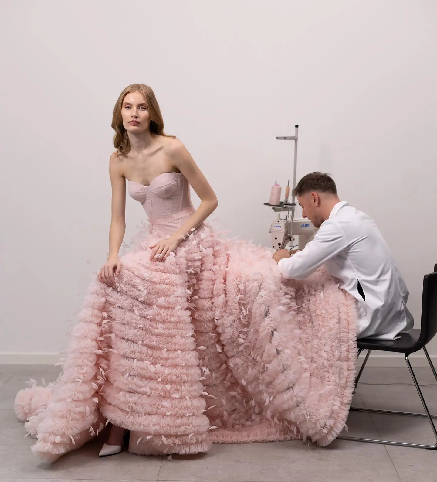 

Striking Blush Pink Ruffles Trimmed Tulle Maxi Gowns With A Corset Bustier Feather A-line Long Layered Tutu Tulle Bridal Dresses