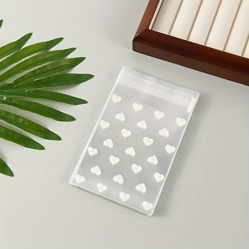 50 шт./уп. Плямостійкі самоклеючі поліетиленові пакети з візерунком у формі серця, одноразові багатоцільові матеріали для подарункової упаковки