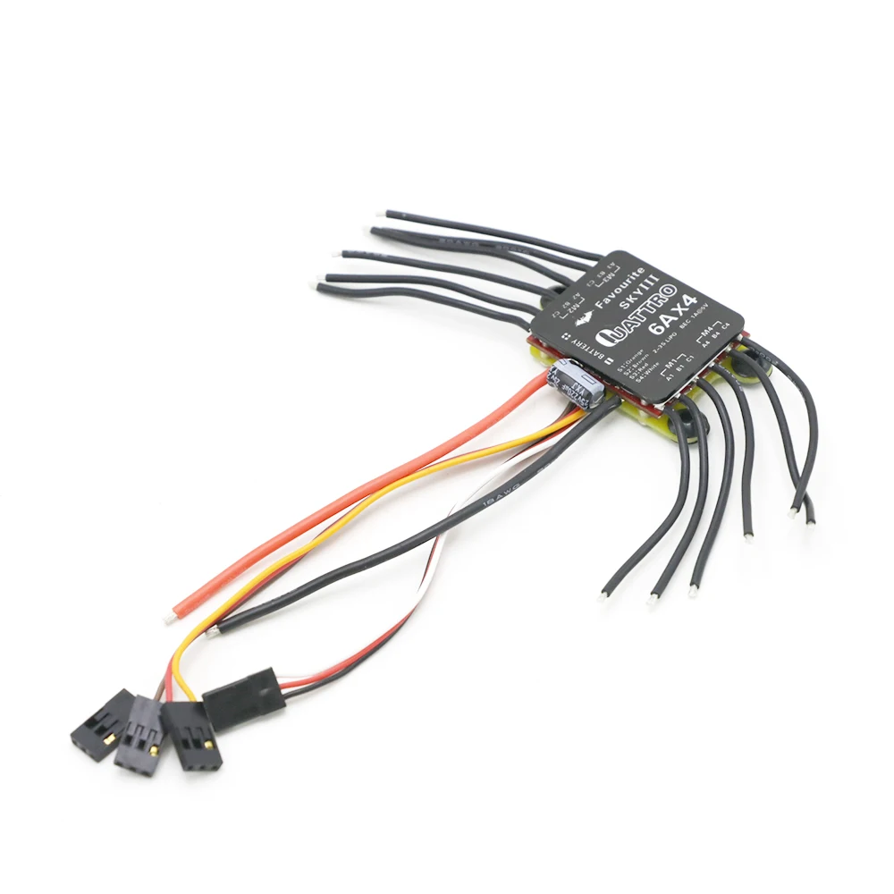 Gros plan sur les dissipateurs thermiques et les circuits de l'ESC 4 en 1 pour micro moteurs brushless 6A/12A/20A/30A