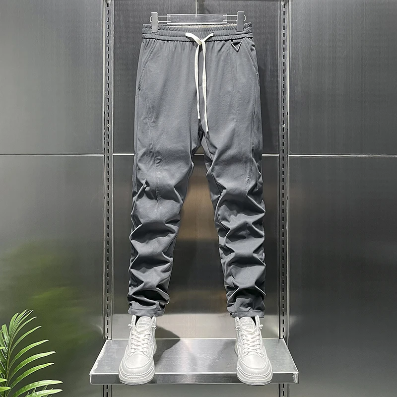 Summer tapered light business casual pants for men with elastic waist elastic knit loose fit and versatile cropped pant