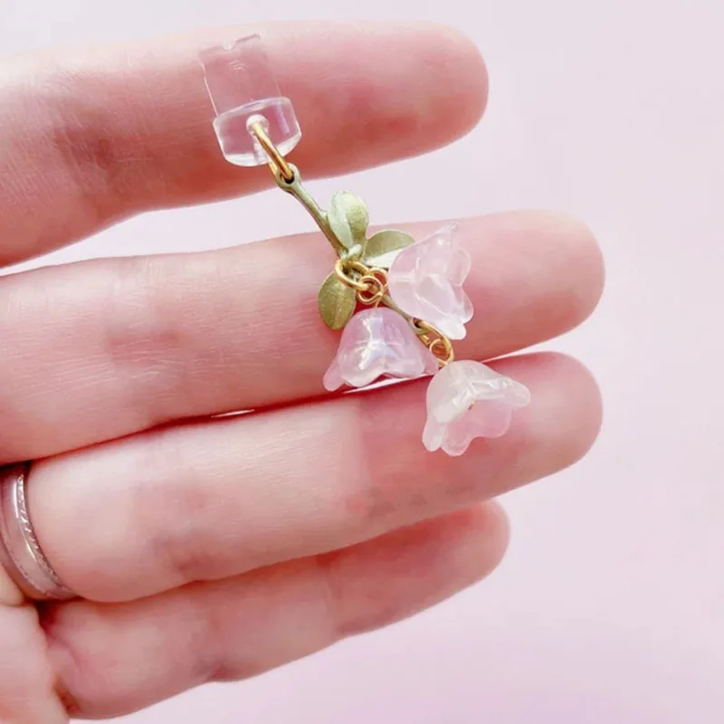 Charming Pink Lily of the Valley Phone Accessory with Green Leaf Accent