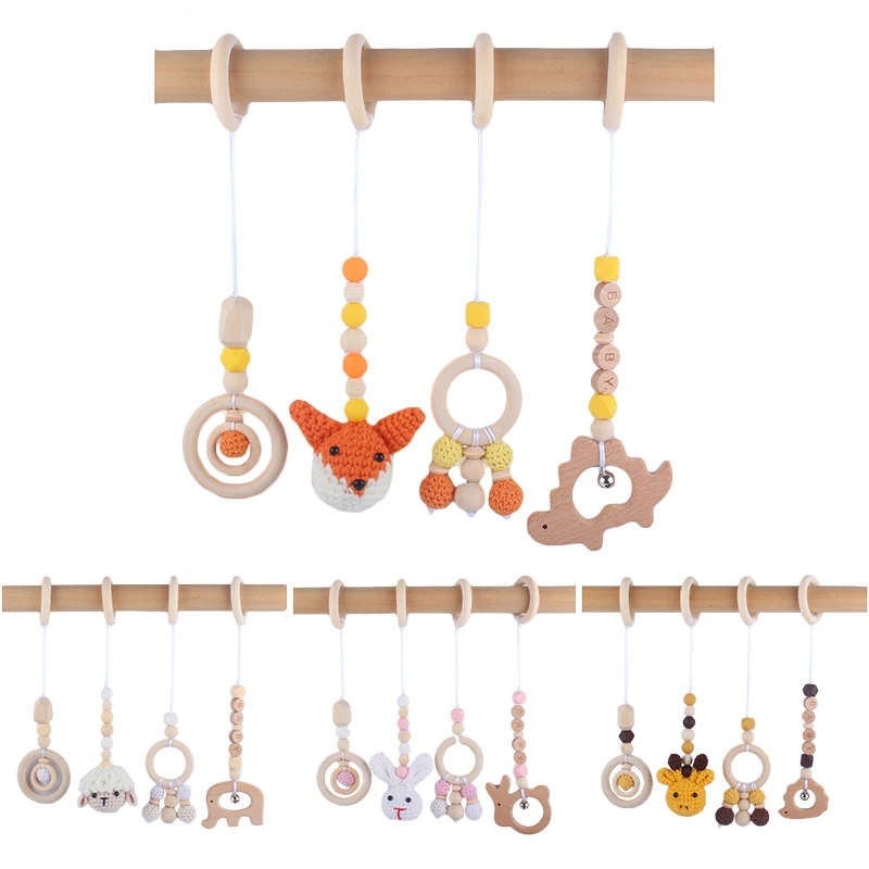 

4Pcs/Set Baby Rattles Baby Play Gym Frame Wooden Beech Teether Trolley Stroller Hanging Pendants Toys Ring Nursing Rattle Toys