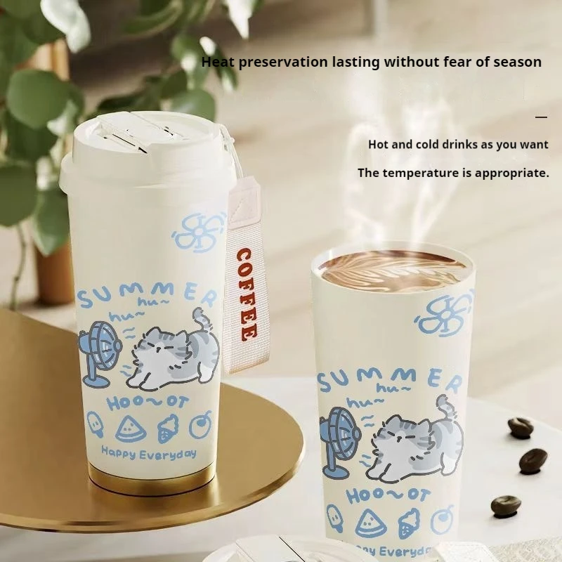 Two KittyNook Cat Co. Cartoon Kitty Stainless Steel Travel Cups labeled "SUMMER" and "Happy Everyday" steam on a table.
