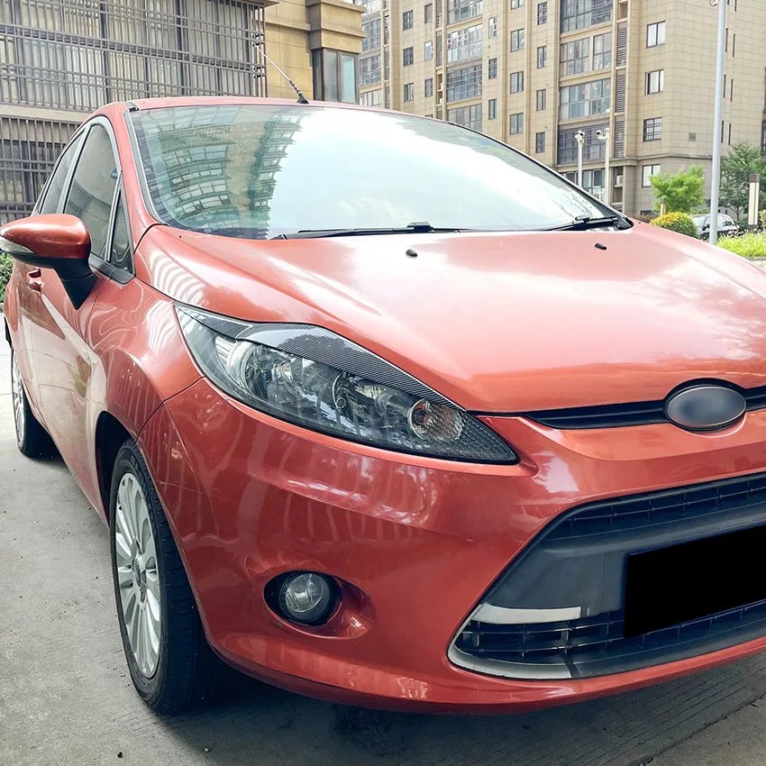2008 To 2012 For Ford Fiesta MK6 ABS Gloss Black Carbon Fiber Look Front Headlight Eyebrow Eyelids headlight lamp cover headlight eyebrows eyelid Light Stickers car sticker Lamp Cover