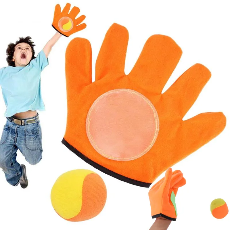 ChildrenThrowStickyBallToyCatchRacketMultiplePeopleOutdoor