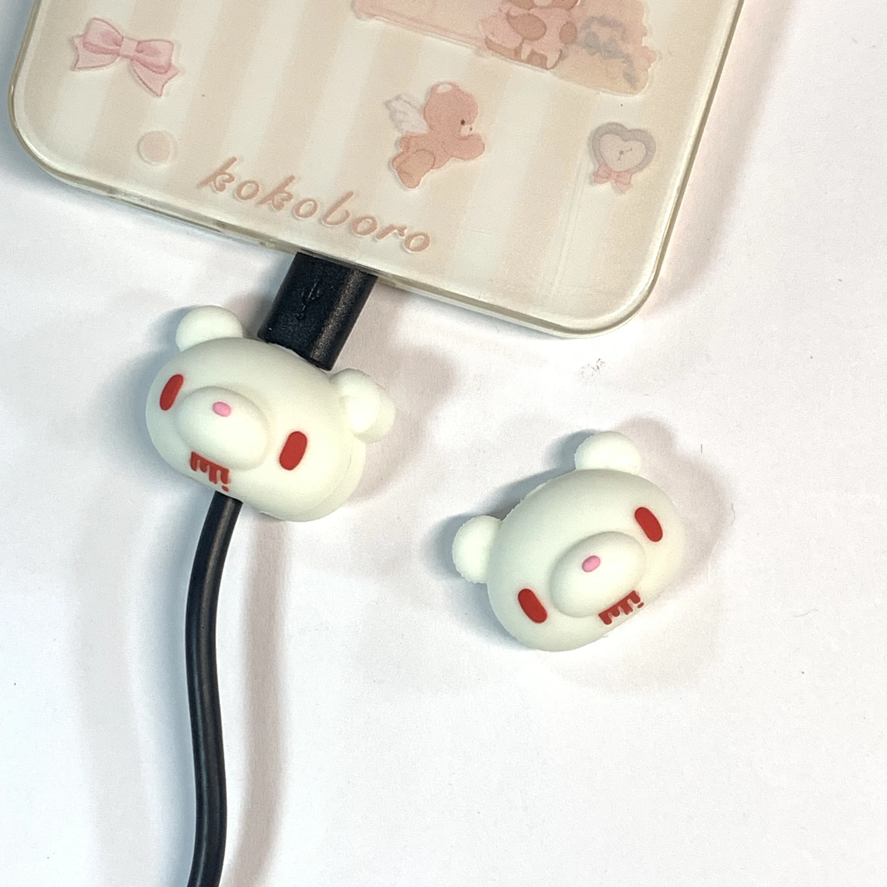 Fluorescent Gloomy Bear Cable Protectors Fluorescent Gloomy Bear cable protectors Iconic edgy-cute glow-in dark safeguard phone cables Perfect for fans