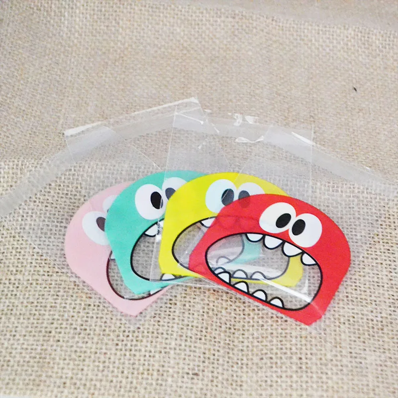 50/100pcs 귀여운 괴물 날카로운 치아 비닐 봉투 크리스마스 선물 포장 가방 웨딩 사탕 가방 OPP 가방 생일 부활절 파티 장식