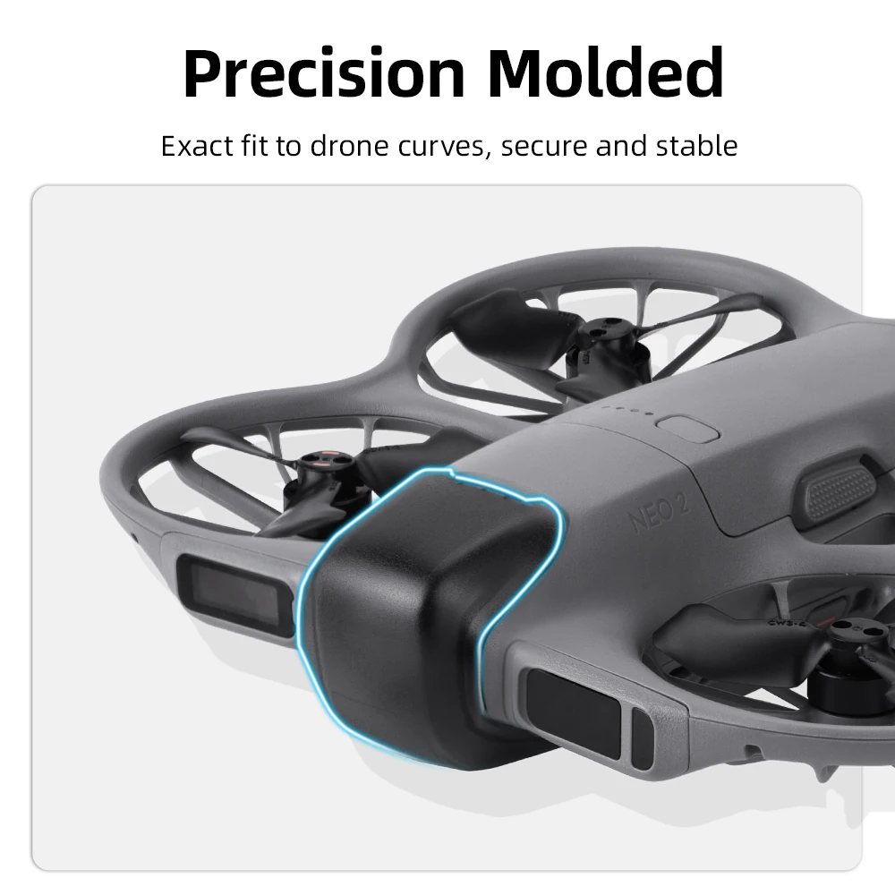 Protège-objectif pour drone Neo 2 posé à plat, coque de protection transparente anti-choc avec reflets lumineux.