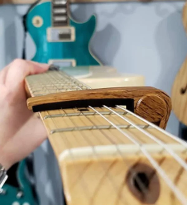 Description Picture 4 of itemMiwayer Guitar capo for 6 String Steel Acoustic and Electric Guitars with 4 Picks for Free