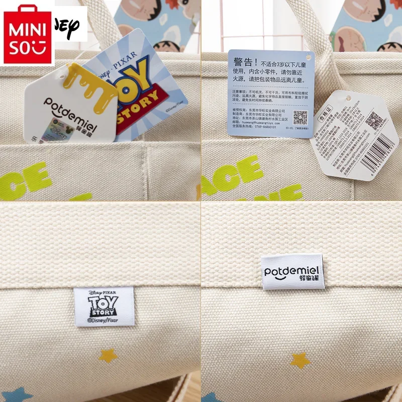 MINISO Disney cartoon three eyed pendant cute handbag women's fashionable high-quality canvas carrying crossbody bag