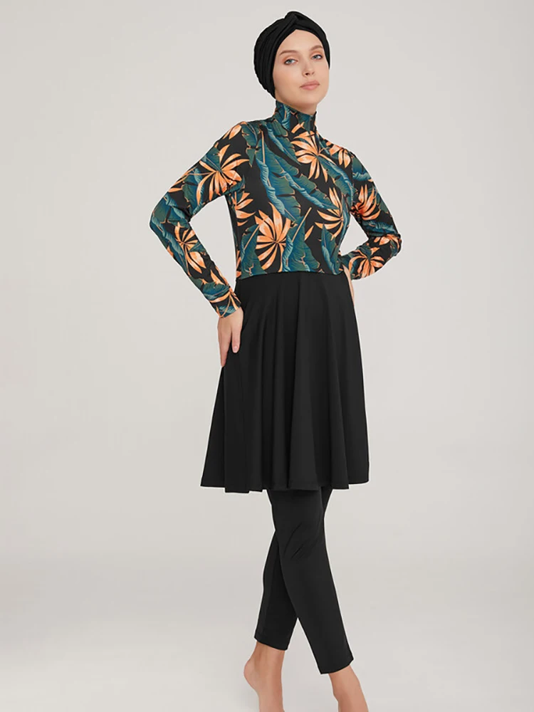 Black swim leggings with secure fit and elastic waistband shown in detail