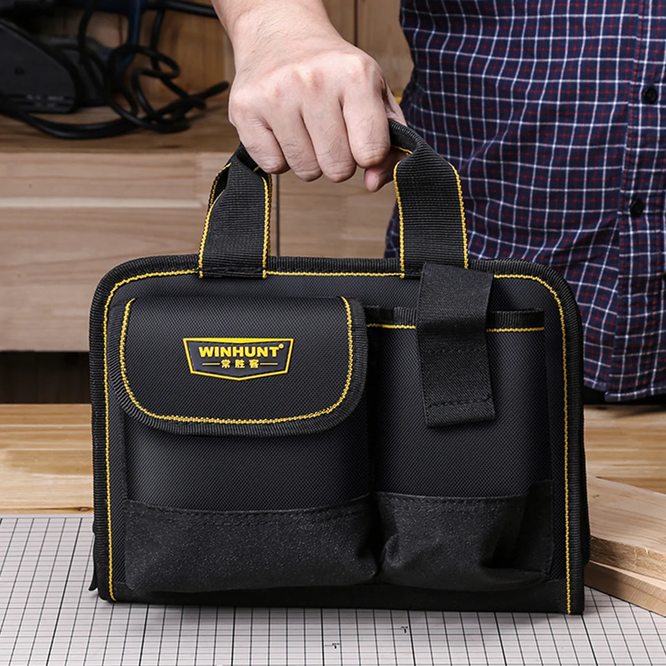 Sac à outils pliable imperméable pour multimètre vu de côté, anse de transport robuste et matériau résistant à l'eau.