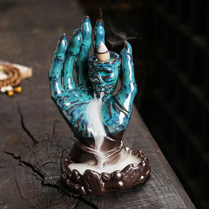

Halloween Skull Decoration Ceramic Backflow Incense Burner Creative Ghost Palm Incense Cone Holder for Aromatherapy Home Decor