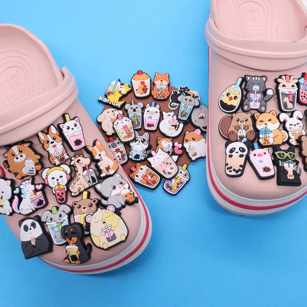 

Wholesale 50pcs PVC Shoe Charms Cute Panda Cat Dog Hamster Milk Tea Accessories Sandal Decoration For Croc Jibz Kids X-mas Gift