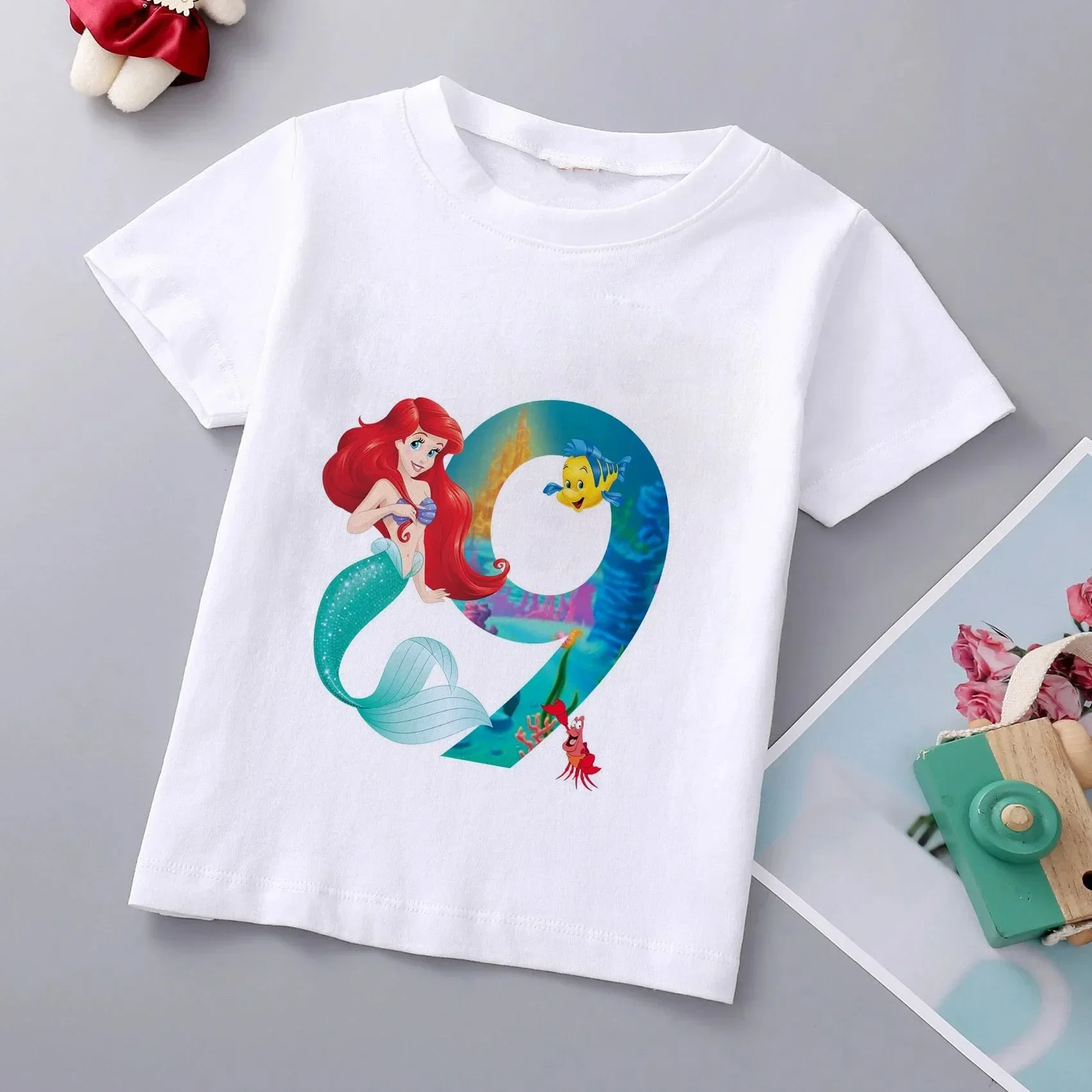 thumbnail image 1 of Camiseta de algodón con estampado de princesa sirena para niñas de la marca Disney, ropa de princesa Ariel, top de dibujos animados para niños de 1 a 9 años, regalo de cumpleaños para niños, 1 of 5
