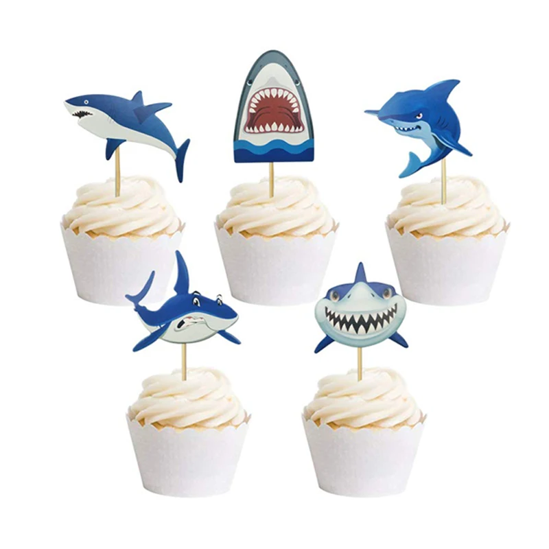 

Baby Shark cupcakes decorated with shark-themed party items Children's birthday party items decorated