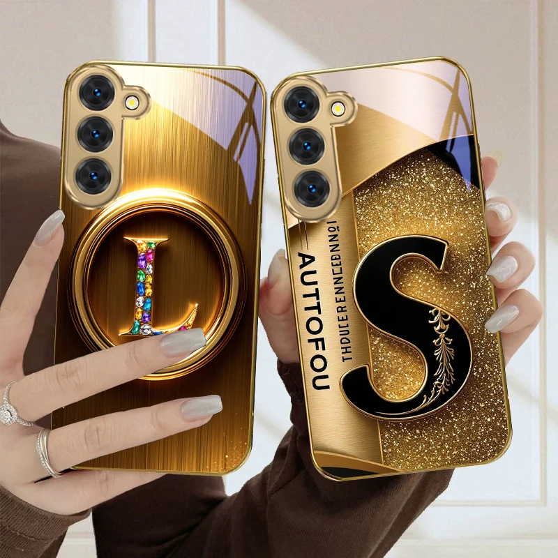 Elegant Golden Glass Phone Case with Ornate S Design